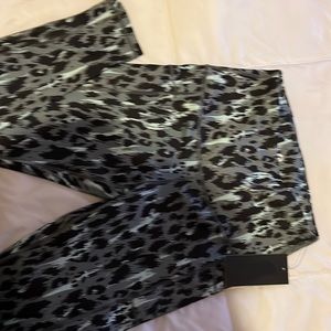 Green cheetah print leggings with pockets on the sides